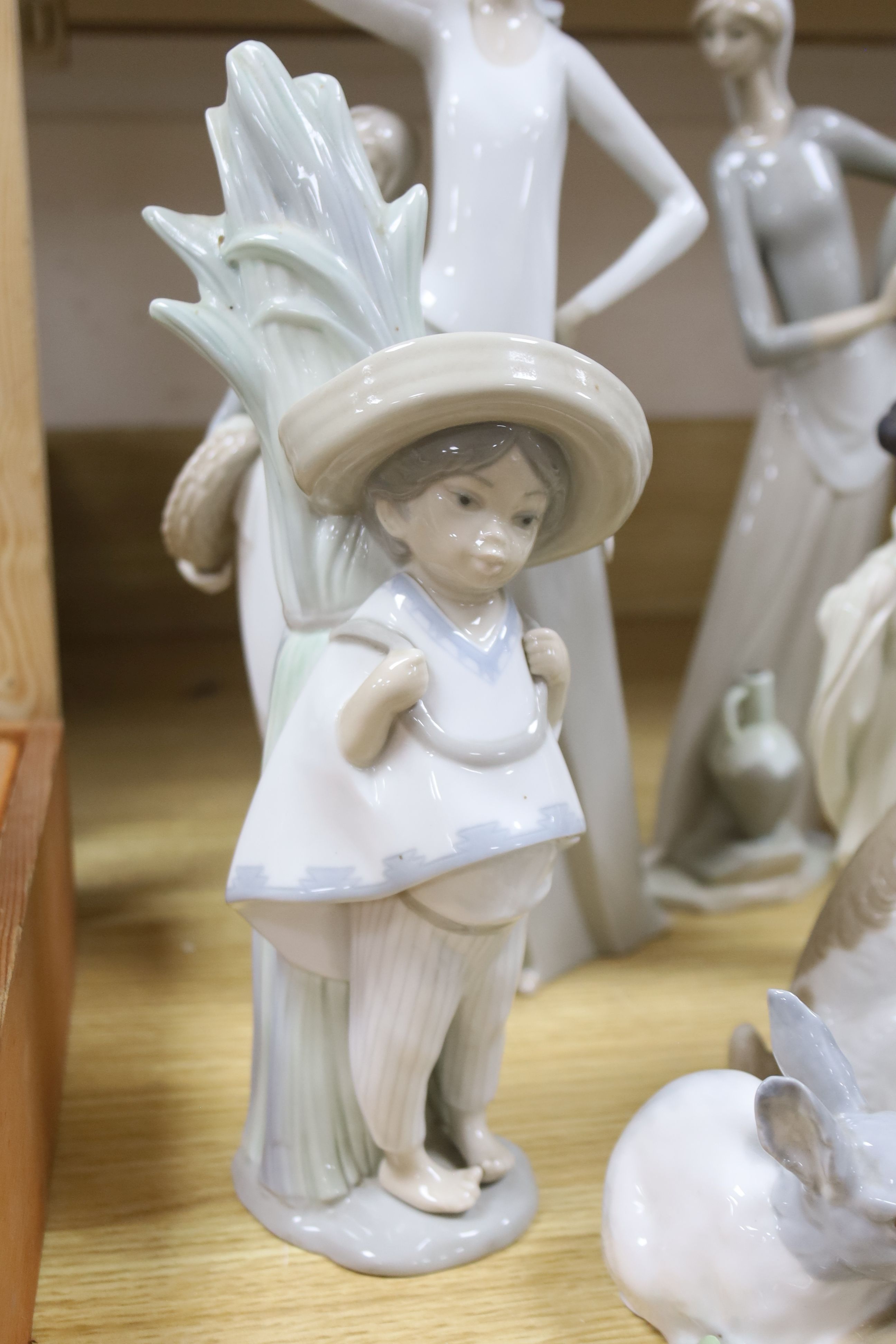 Four pieces of Lladro porcelain and assorted Nao etc (10)